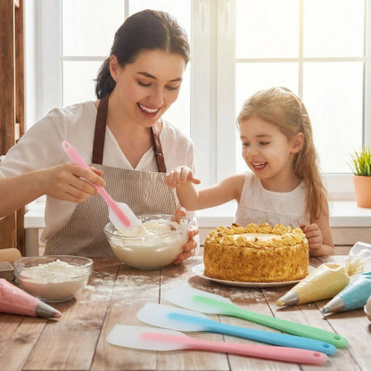 maman prépare crème avec spatule en silicone